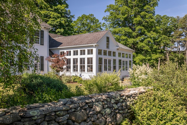 back of house with a sunroom