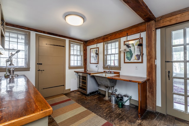 home office with wine cooler and sink