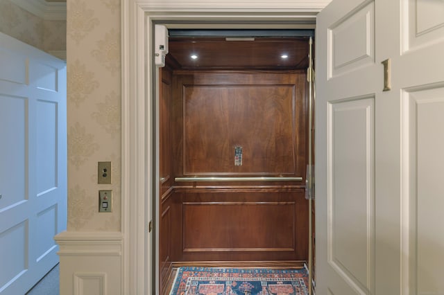 details with elevator and wallpapered walls