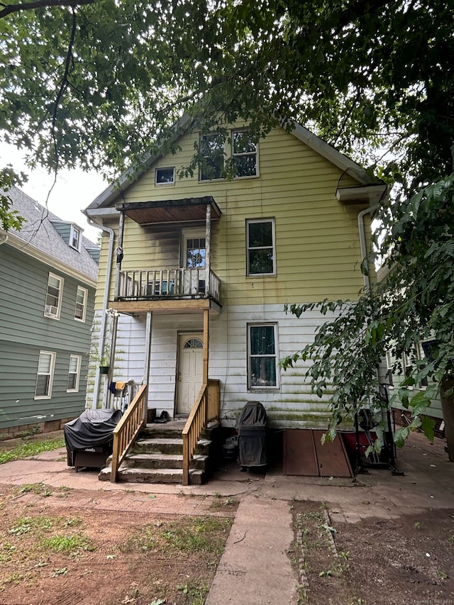 rear view of house with a balcony