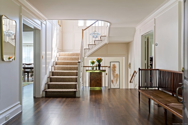 325 Old Mountain Rd, Farmington, CT 06032 - foyer entrance with wood finished floors, a decorative wall, stairway, and ornamental molding