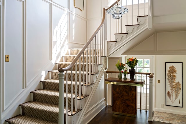 stairs with hardwood / wood-style floors