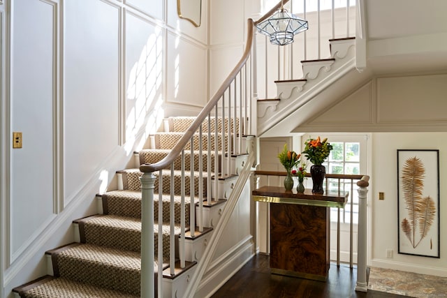 325 Old Mountain Rd, Farmington, CT 06032 - staircase featuring a decorative wall and wood finished floors