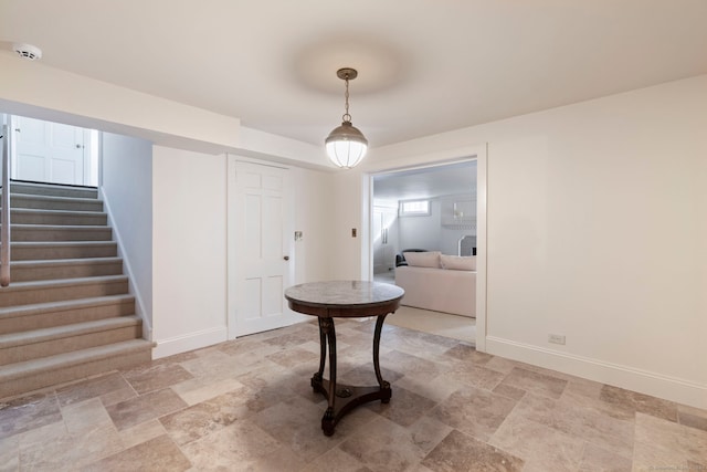 325 Old Mountain Rd, Farmington, CT 06032 - foyer entrance with stone finish floors, stairway, and baseboards