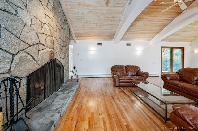 unfurnished living room with light hardwood / wood-style floors, a stone fireplace, baseboard heating, and ceiling fan