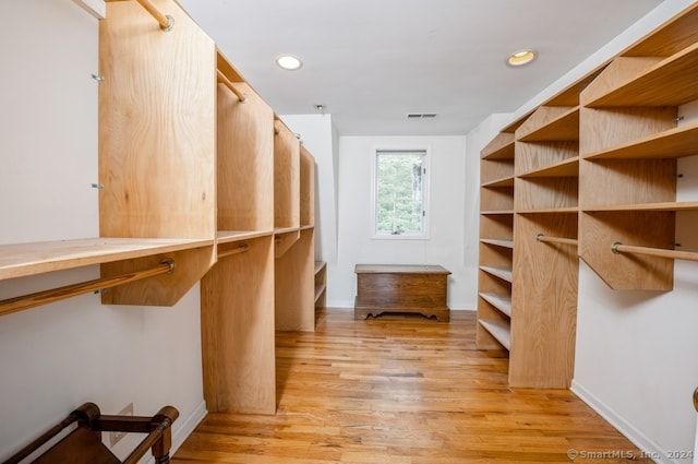 spacious closet featuring light wood-type flooring