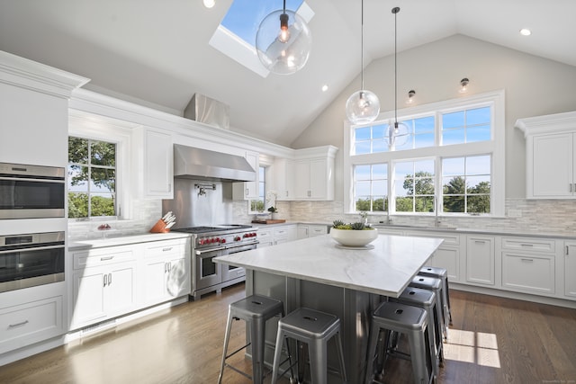 kitchen featuring white cabinetry, a healthy amount of sunlight, and appliances with stainless steel finishes