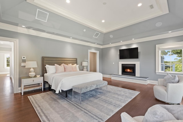 29 Rogues Rdg, Weston, CT 06883 - bedroom with a tray ceiling, crown molding, recessed lighting, a lit fireplace, and dark wood-style flooring