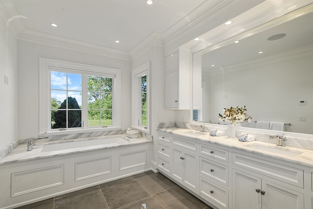 bathroom featuring a bathtub, ornamental molding, and vanity