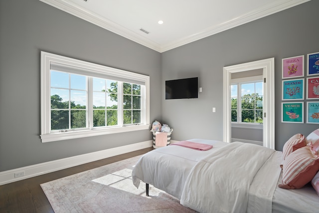 bedroom featuring ornamental molding and dark hardwood / wood-style floors