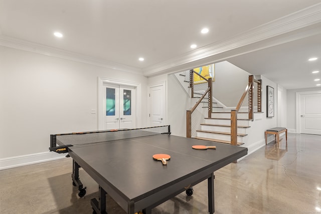 recreation room with crown molding and french doors