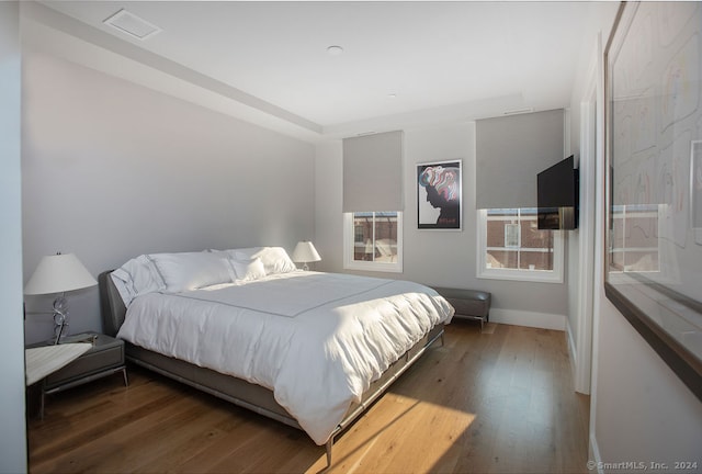 bedroom featuring dark wood-type flooring