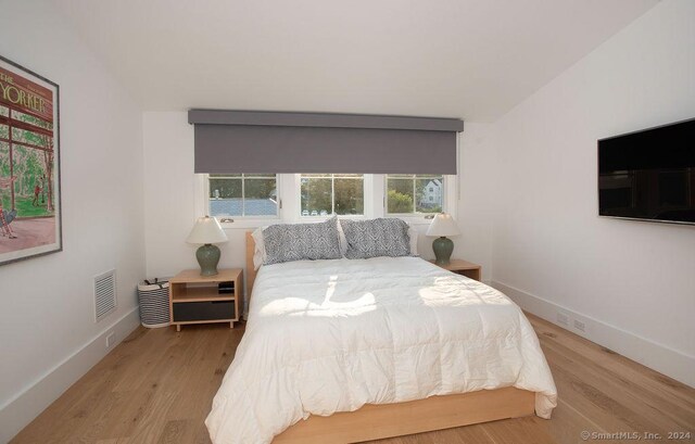 bedroom featuring light hardwood / wood-style floors