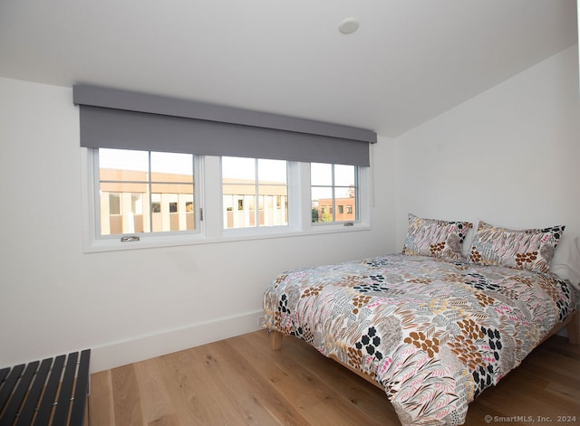 bedroom featuring hardwood / wood-style flooring