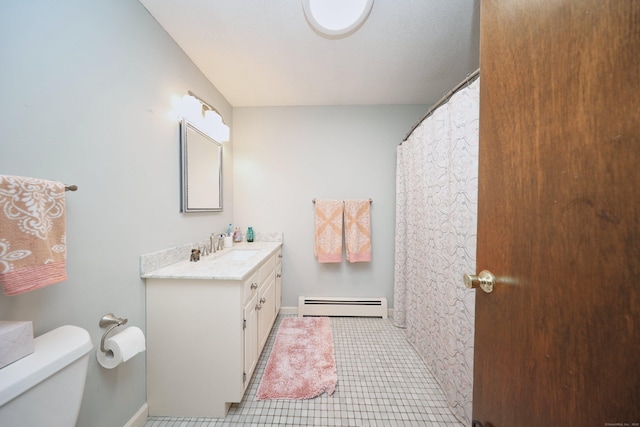 bathroom with toilet, tile patterned floors, vanity, and a baseboard radiator