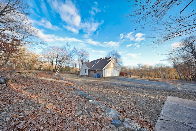 view of side of property with a garage