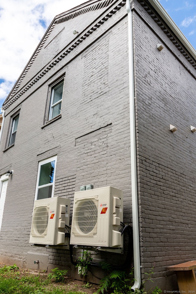 view of home's exterior with ac unit