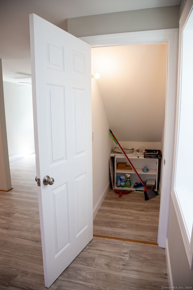 stairs with hardwood / wood-style flooring