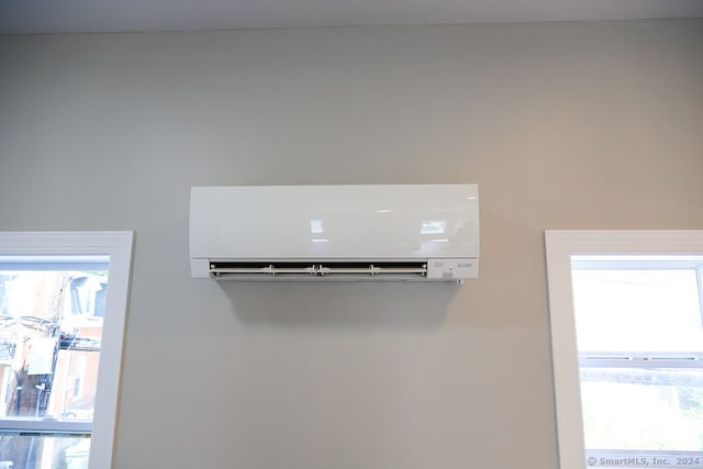 details featuring a wall mounted air conditioner