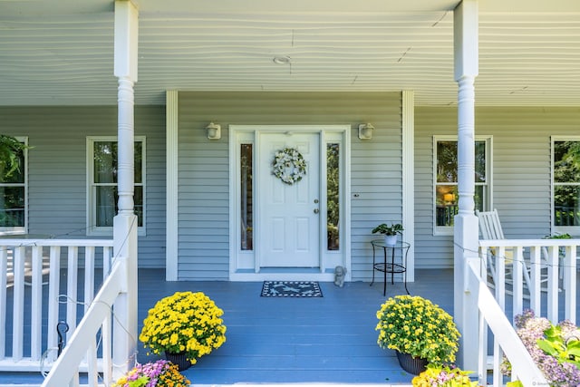 doorway to property featuring covered porch