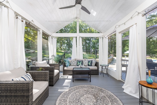 sunroom / solarium with plenty of natural light, ceiling fan, lofted ceiling, and wooden ceiling