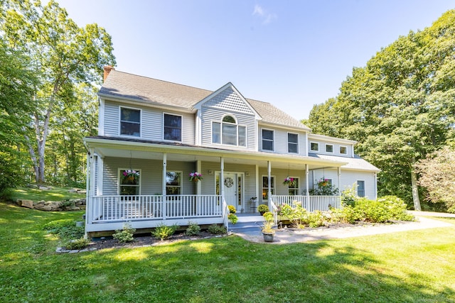 view of front of home with a front lawn and a porch