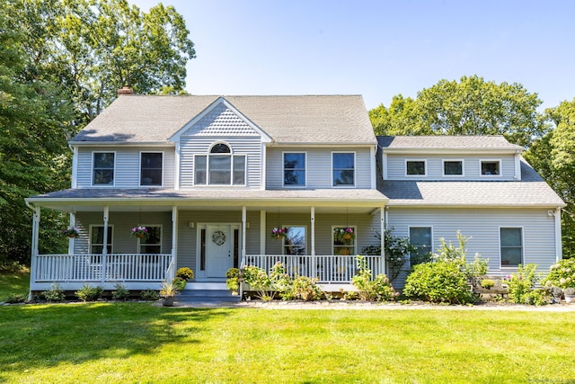 view of front of home with a front lawn and a porch