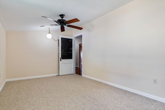 unfurnished room featuring light colored carpet, ceiling fan, and vaulted ceiling