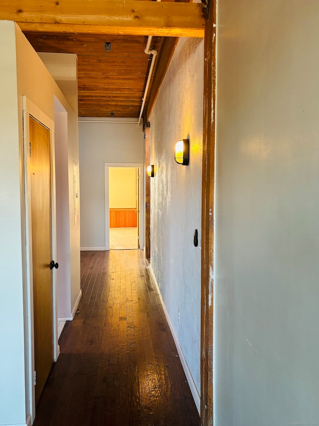 hallway featuring wood ceiling and dark wood-type flooring