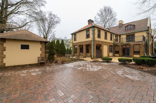 back of house with a patio area