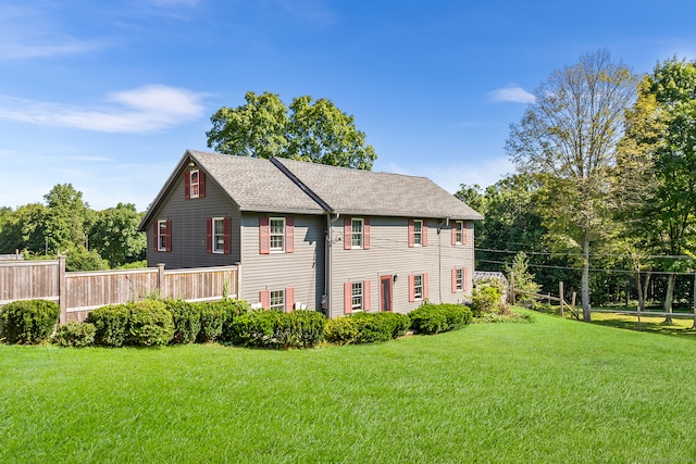 view of side of home featuring a yard