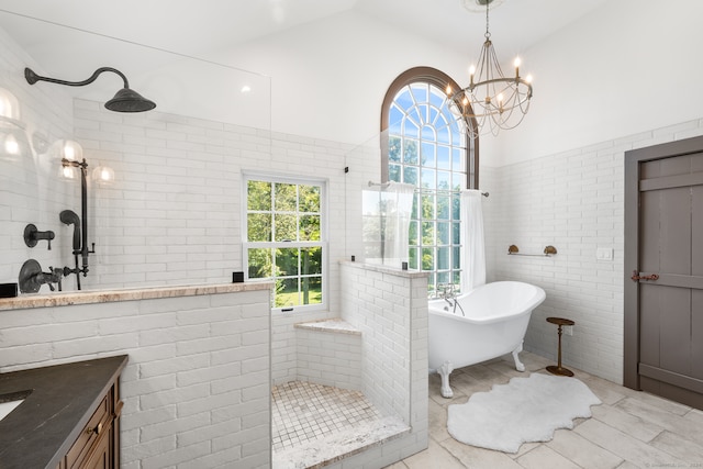 bathroom featuring vanity, lofted ceiling, plus walk in shower, a chandelier, and tile patterned floors