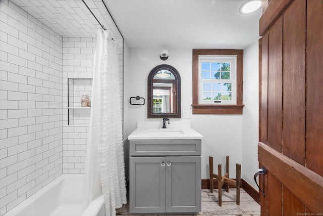 bathroom featuring vanity and shower / bath combo with shower curtain