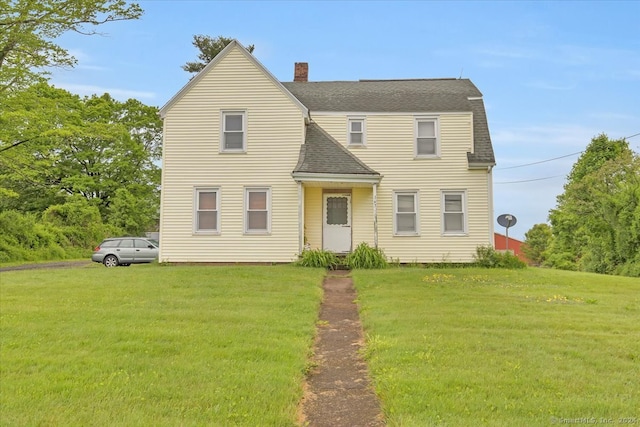 view of front of property with a front lawn