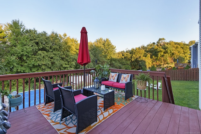 deck featuring a lawn and an outdoor living space