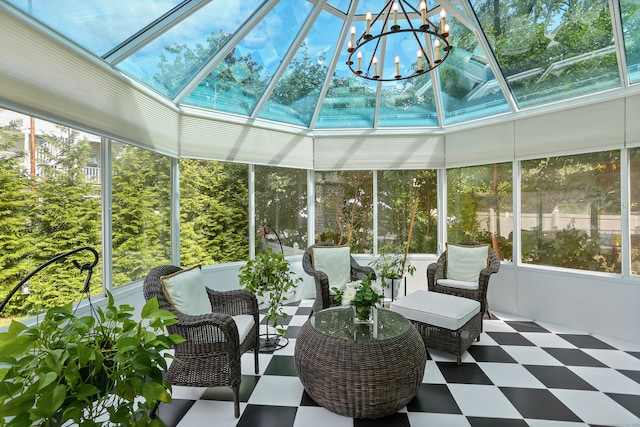 unfurnished sunroom with a healthy amount of sunlight and a notable chandelier