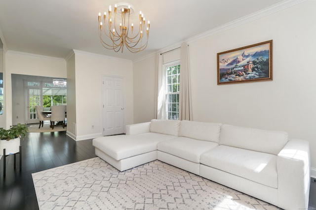 living room featuring ornamental molding, wood-type flooring, and a chandelier