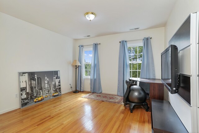 office with light hardwood / wood-style flooring