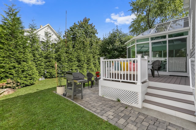 view of yard featuring a patio and a deck