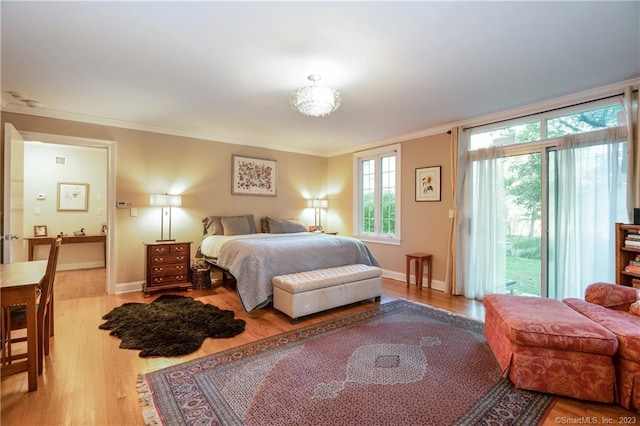 bedroom featuring ornamental molding and wood-type flooring