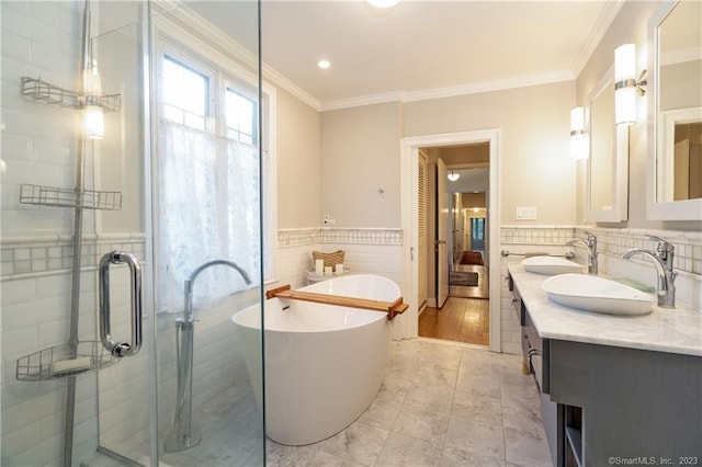 bathroom featuring hardwood / wood-style floors, plus walk in shower, ornamental molding, vanity, and tile walls