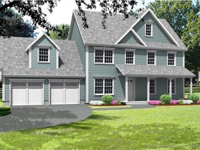 view of front facade with a front yard and a garage