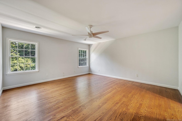 unfurnished room featuring ceiling fan and light wood-type flooring