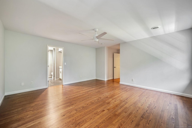 unfurnished room featuring ceiling fan and dark hardwood / wood-style flooring