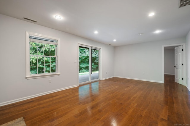 spare room with dark hardwood / wood-style flooring