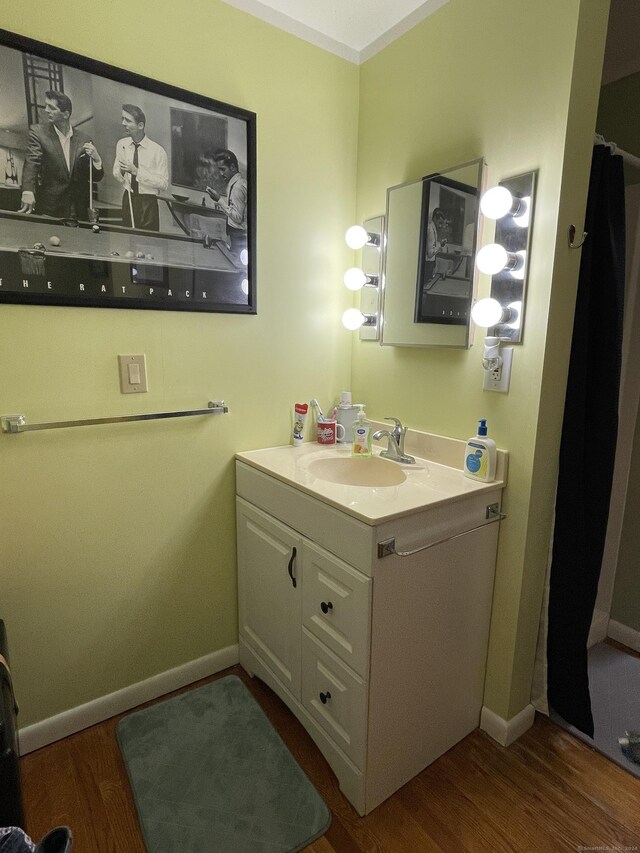 bathroom with vanity and wood-type flooring