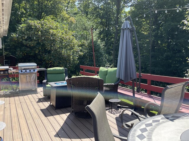 wooden deck with grilling area