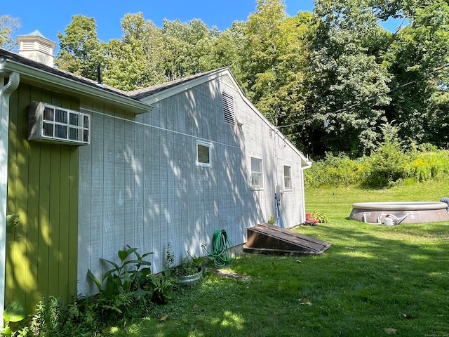 view of side of home featuring a yard