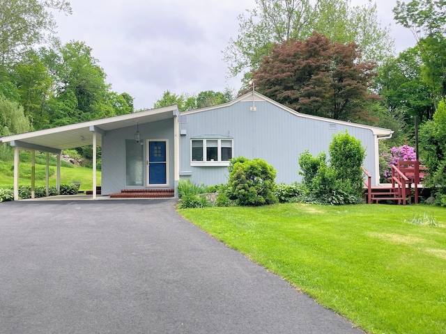 25 Old Middle Rd, Brookfield, CT 06804 - view of front of house with a front yard, asphalt driveway, a carport, and a deck