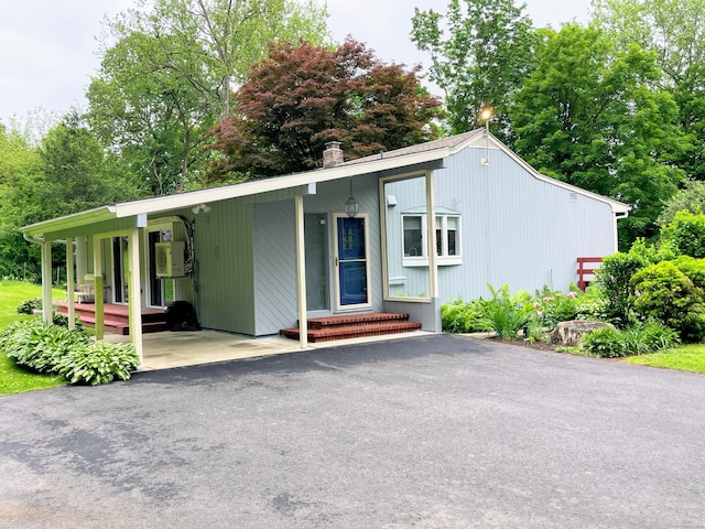 25 Old Middle Rd, Brookfield, CT 06804 - view of front of home with a chimney and view of scattered trees